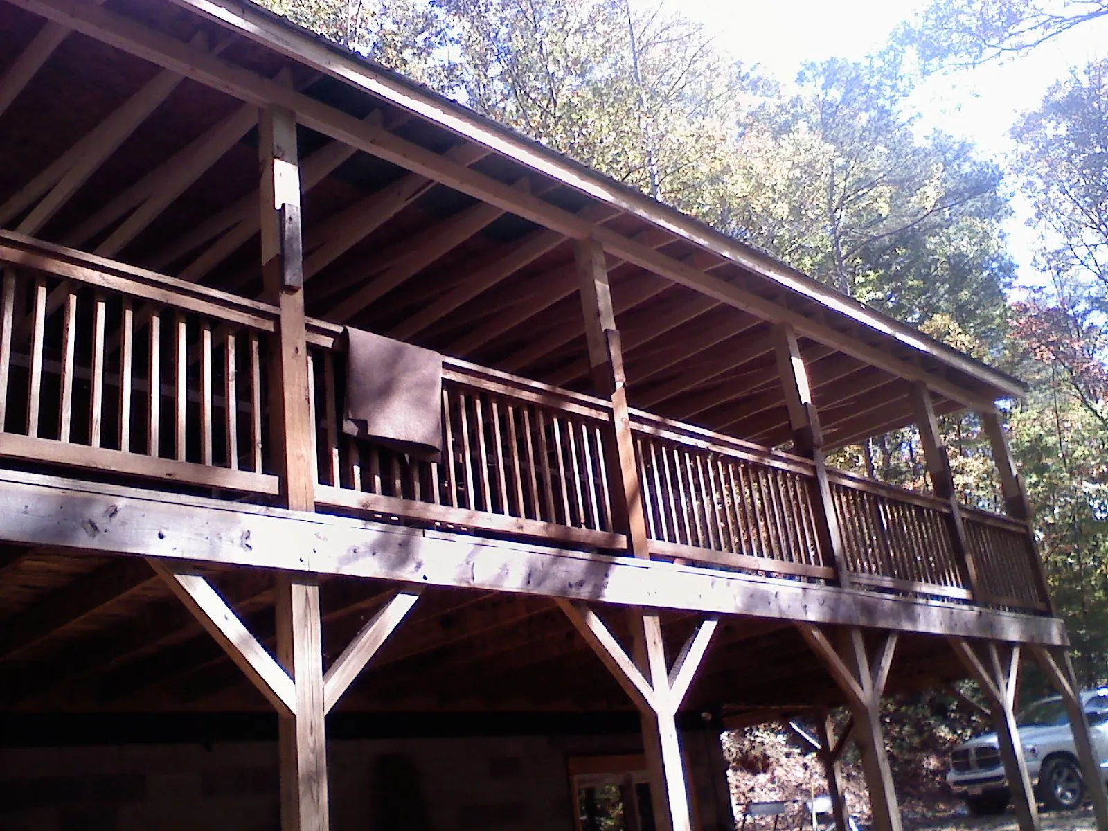 Timber framing under a new elevated porch and deck — Roof Leak Repair in Northville by Roofing Brothers
